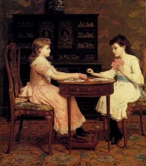 Two girls playing cards